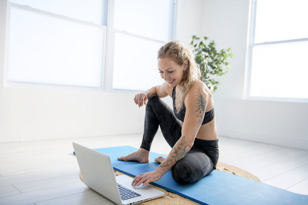 nice woman practicing yoga in job studioの写真素材