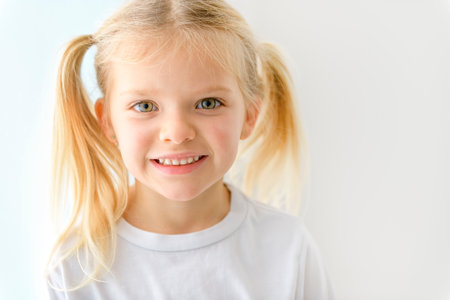 Portrait of happy smiling child girl isolated on white backgroundの写真素材