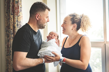 New born baby boy with the family in the hospital room