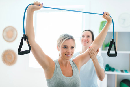 Modern rehabilitation physiotherapy clinic with professional and client
