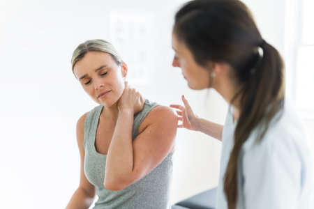 Modern rehabilitation physiotherapy clinic with professional and clientの写真素材