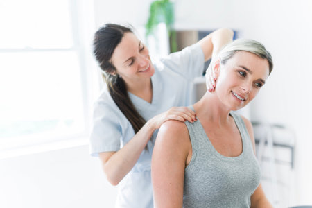 Modern rehabilitation physiotherapy clinic with professional and clientの写真素材