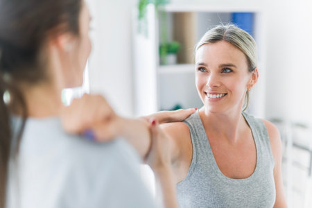 Modern rehabilitation physiotherapy clinic with professional and client