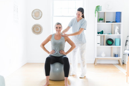 Modern rehabilitation physiotherapy clinic with professional and client