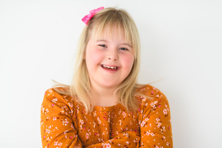 Portrait of beautiful little girl having down syndromeの写真素材