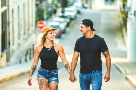 Beautiful couple having fun outdoors on urban backgroundの写真素材