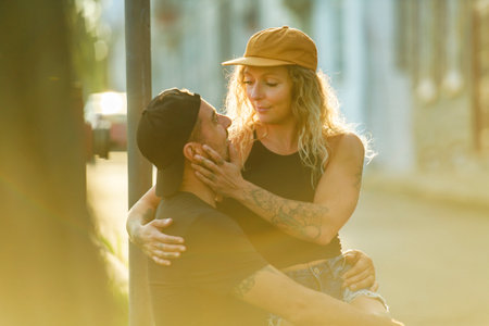Beautiful couple having fun outdoors on urban backgroundの写真素材