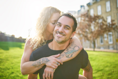 Beautiful couple having fun outdoors on urban backgroundの写真素材