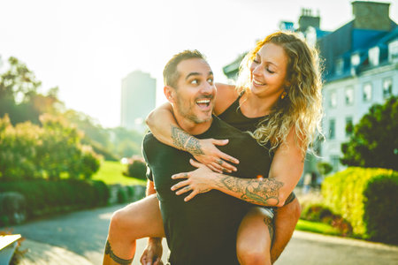 Beautiful couple having fun outdoors on urban backgroundの写真素材