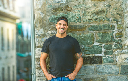 portrait caucasian man outside on industrial urban background