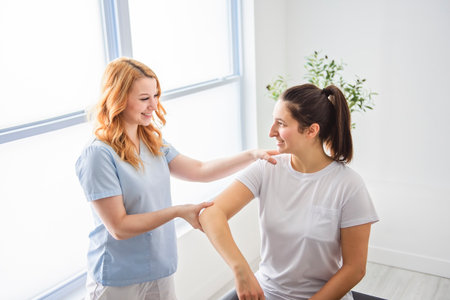 Modern rehabilitation physiotherapy at work with clientの写真素材