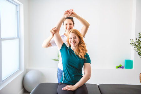 Modern rehabilitation physiotherapy at work with clientの写真素材