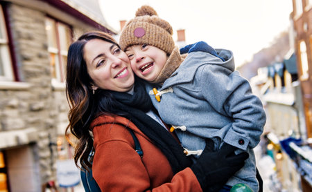 mother with little son having fun together outdoor on frosty dayの写真素材