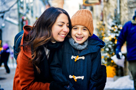 mother with little son having fun together outdoor on frosty dayの写真素材