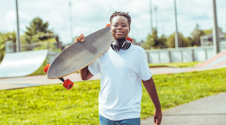 Boy with Longboard at Park having funの写真素材