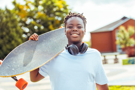 Boy with Longboard at Park having funの写真素材