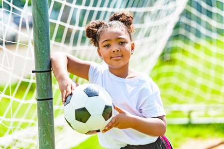 happy soccer player outdoor in sunny dayの写真素材