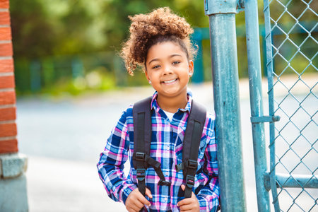 child going back to school with a backpackの写真素材