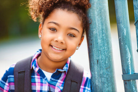 child going back to school with a backpackの写真素材