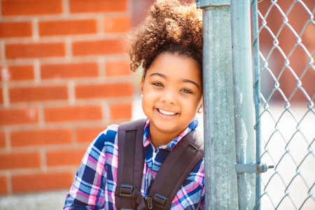 child going back to school with a backpackの写真素材
