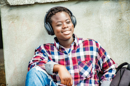Portrait Of Male Teenage Student Outside Buildings with headphoneの写真素材