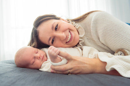 A Portrait of a beautiful mother, with her nursing baby