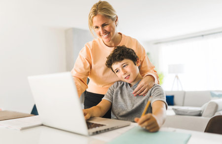 Mom helping kid with homework at home