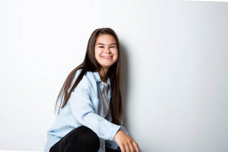 18 years old child girl posing in white backgroundの写真素材