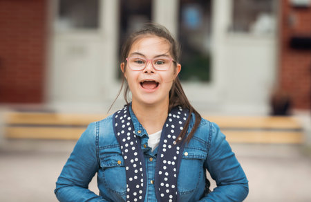portrait of a child girl outside on a school playground