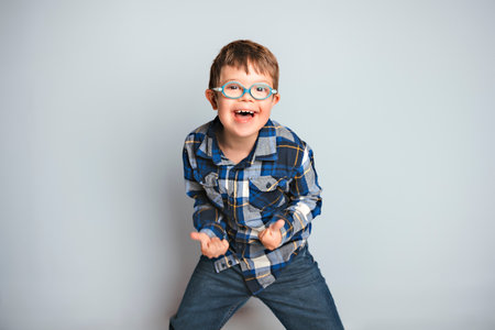 A child boy posing on studio white backgroundの写真素材