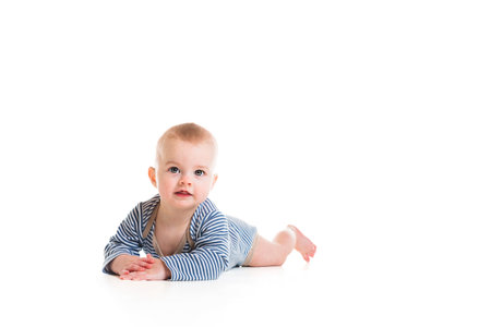 Cheerful baby boy toddler on white studio backgroundの写真素材