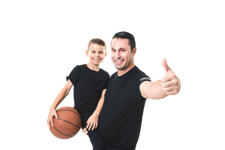 father and son playing basketball isolated on white background