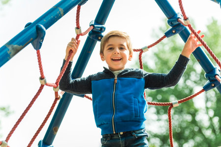 cute boy having fun on a playground