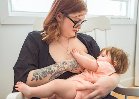 Soft photo young mother feeding breast her baby at home in bed room