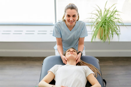 Modern rehabilitation physiotherapy woman worker with woman client