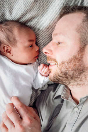 A Portrait of a beautiful father, with her nursing babyの写真素材