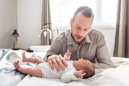 A Portrait of a beautiful father, with her nursing baby