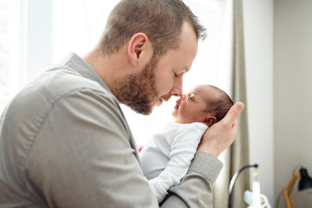 A Portrait of a beautiful father, with her nursing babyの写真素材