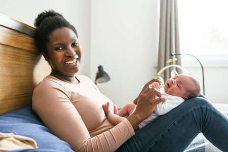 A Portrait of a beautiful black mother, with her nursing baby