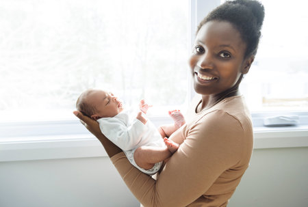 A Portrait of a beautiful black mother, with her nursing baby