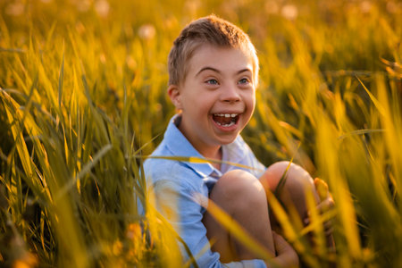 Portrait of a little boy having fun at the sunset time