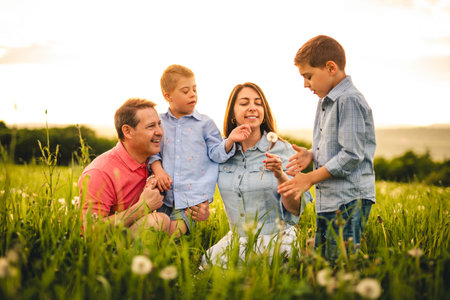 Nice family Playing on great field at Sunset