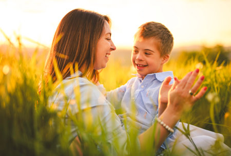 Nice mother and child Playing on great field at Sunset