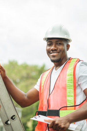 man with hard hat to house inspector roof houseの写真素材