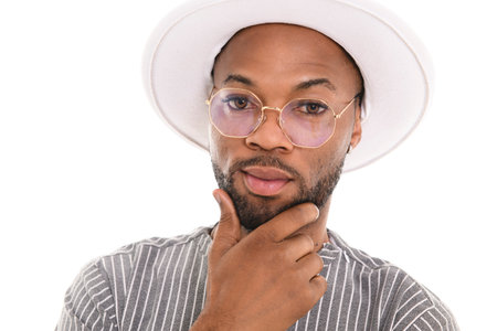 Portrait of black fashion American wearing great looking clothes with white hat