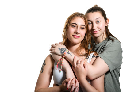 Happy lesbian couple on studio white background.の写真素材