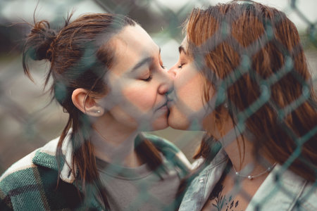 Lesbian Couple Together Outdoors in a rainy day