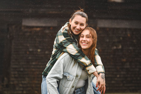 Lesbian Couple Together Outdoors in a rainy day