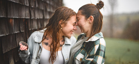 Lesbian Couple Together Outdoors in a rainy day