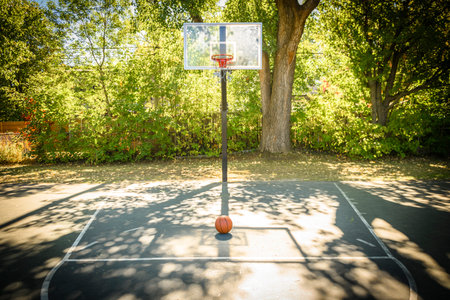 Basketball ball on the ground. Basketball on the indoor court. Sports gear without people.の写真素材